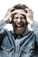 portrait-of-screaming-man-with-dirty-face-MAEF12190.jpg